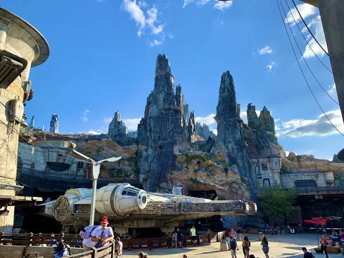 The Millennium Falcon beneath the rock spires of Black Spire Outpost in Galaxy's Edge, Hollywood Studios