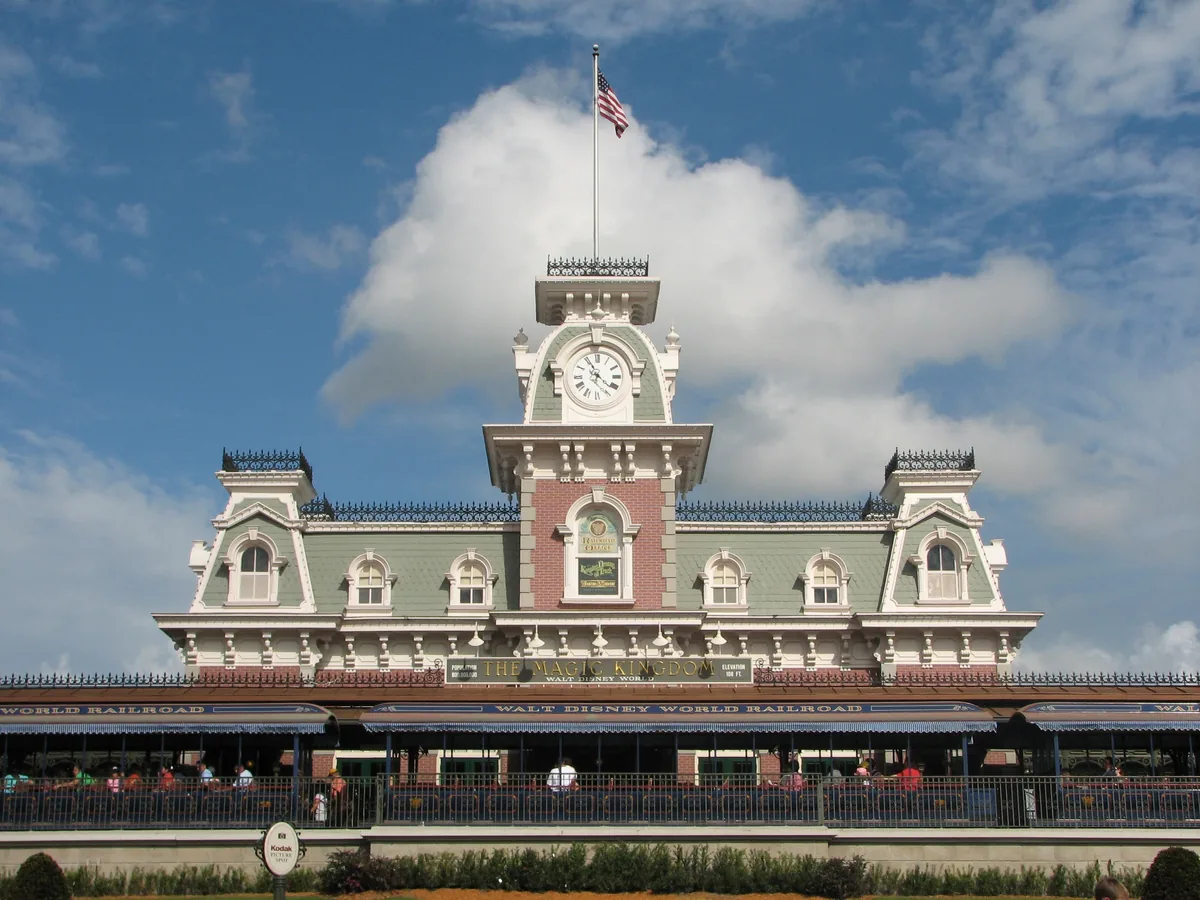 Victorian Main Street train station with clock tower at the Magic Kingdom entrance