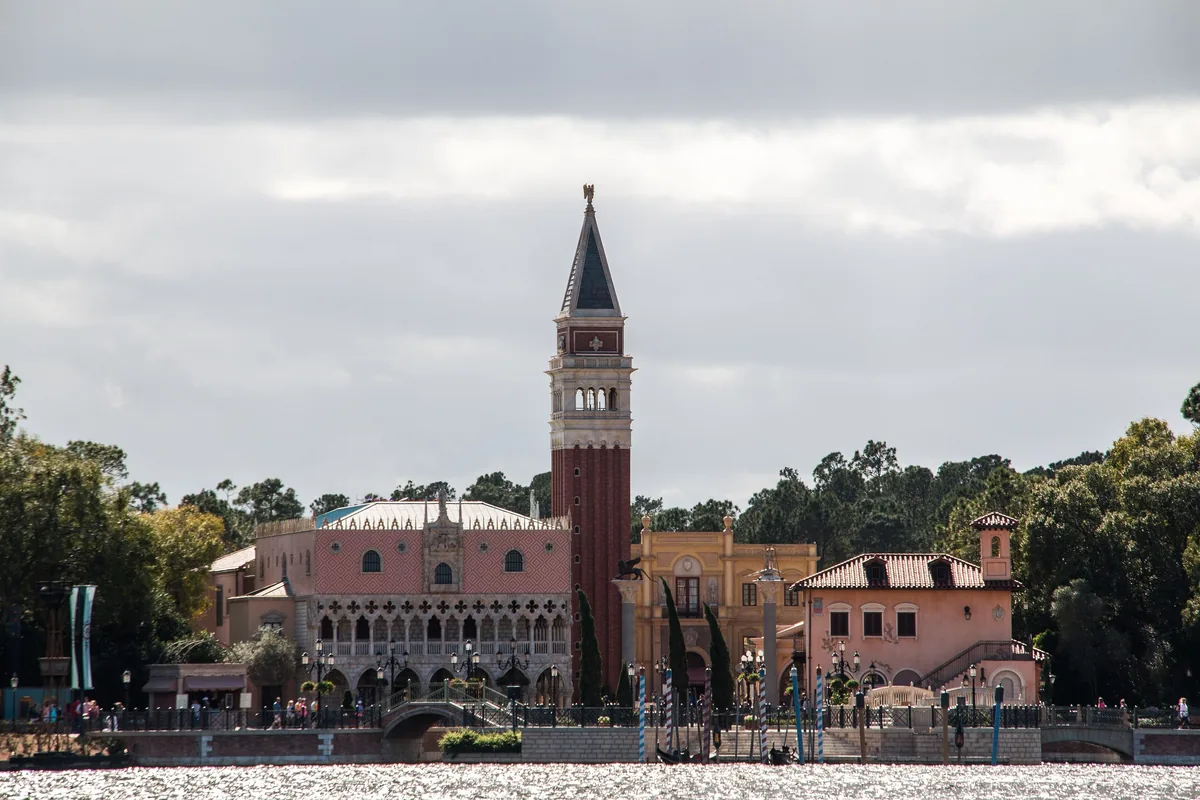 EPCOT's Italy pavilion with its Venetian bell tower and Doge's Palace facade across World Showcase Lagoon