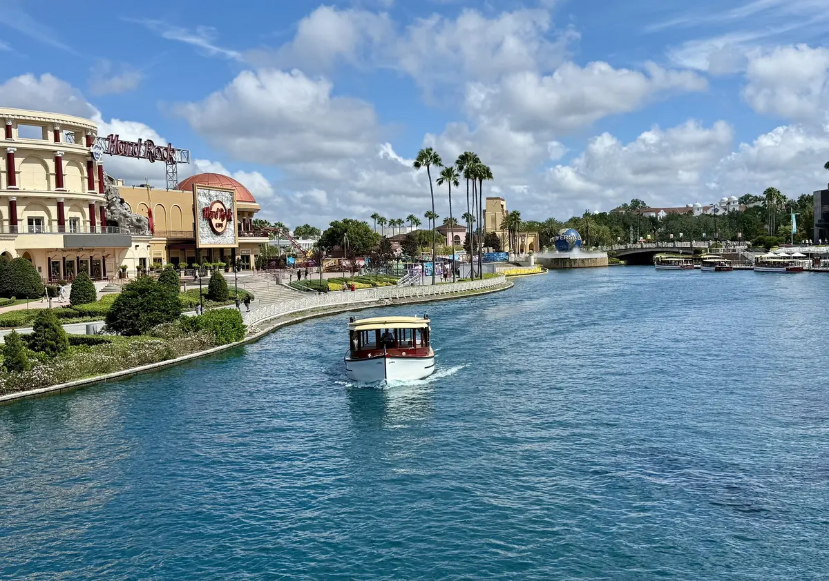 A water taxi on the canal through Universal CityWalk, with Hard Rock Cafe on the bank
