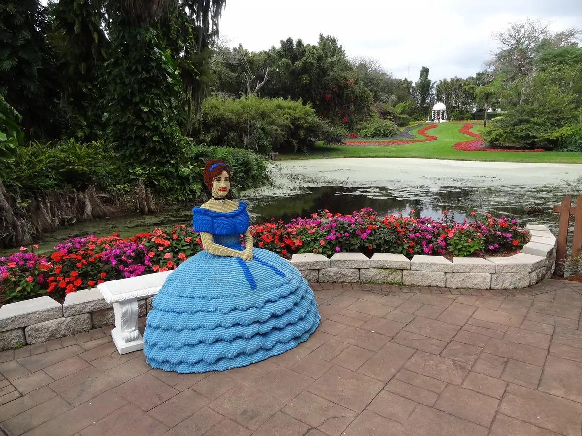 A LEGO Southern belle beside a pond in the historic Cypress Gardens at LEGOLAND Florida