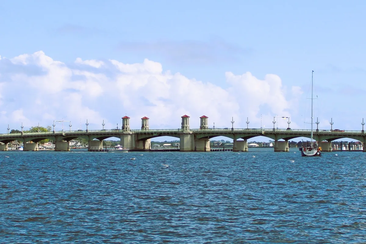The Bridge of Lions spanning the Matanzas River in St. Augustine under a bright, cloudy sky