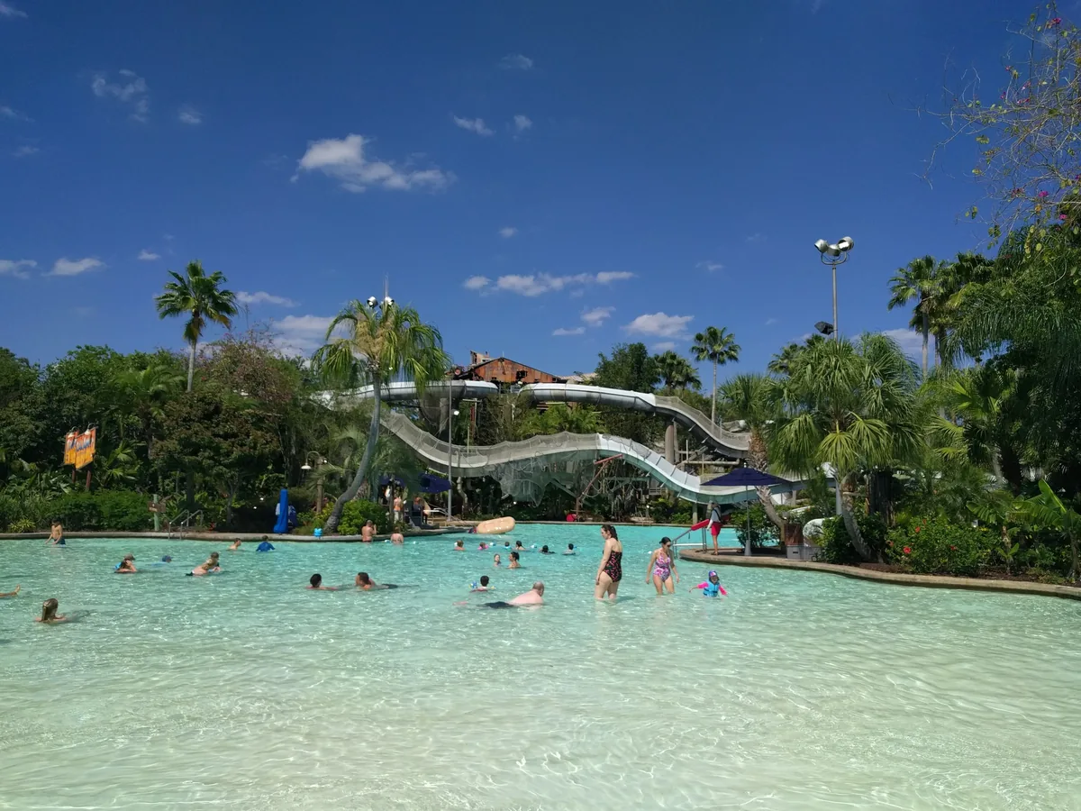 Crush 'n' Gusher water-coaster slides winding down to a clear pool at Disney's Typhoon Lagoon