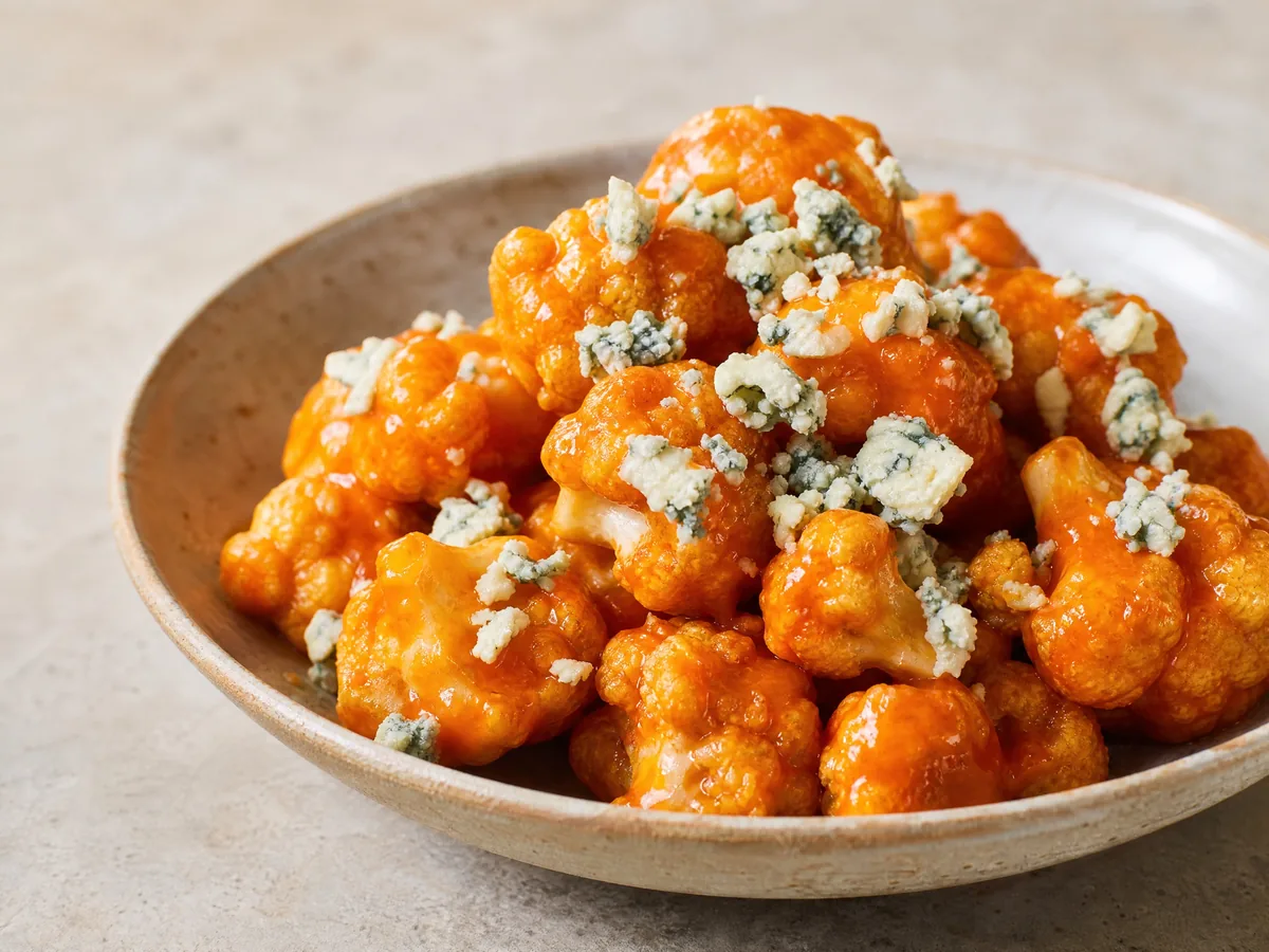 Tempura cauliflower glazed in hot sauce and scattered with blue cheese