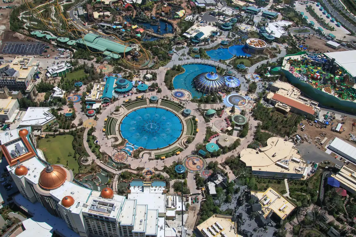 Aerial view of Celestial Park at Universal Epic Universe with its round fountain and paths