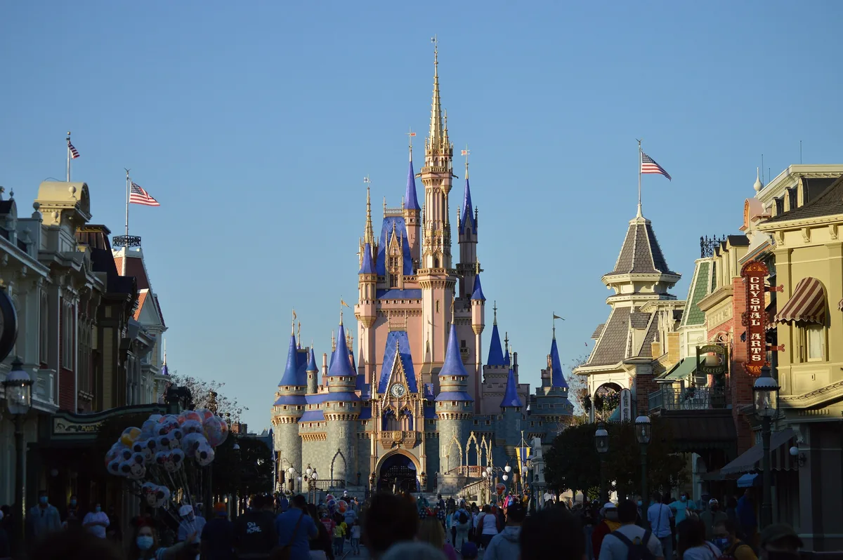 Cinderella Castle at the end of Main Street, U.S.A., Magic Kingdom, under a clear blue sky