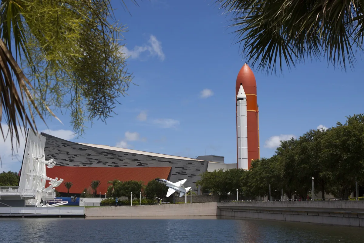 Space Shuttle Atlantis building with its orange external tank replica at Kennedy Space Center